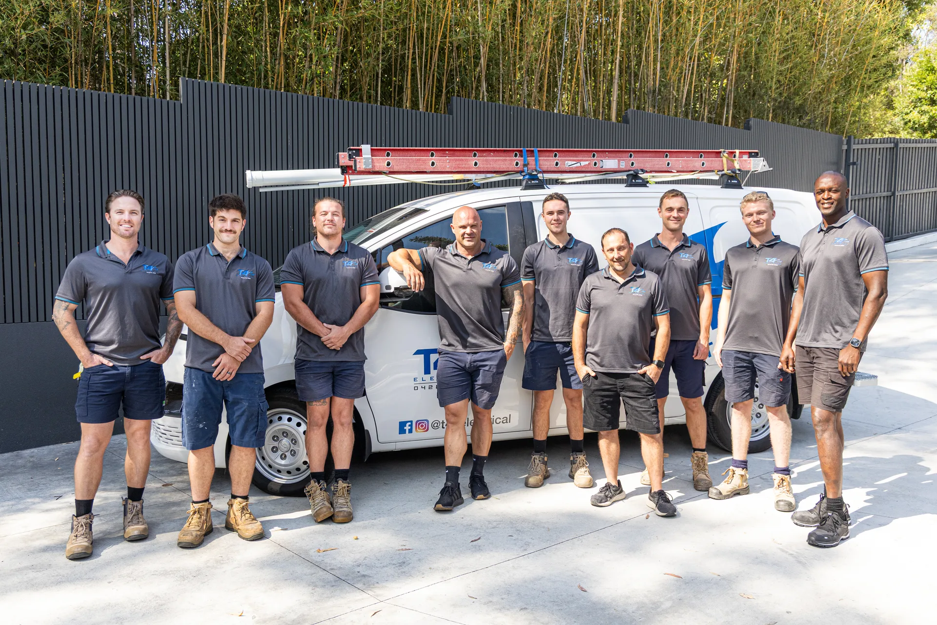 The Family Electrician Carrara team with a service van